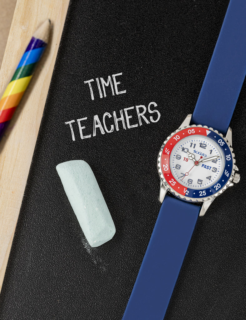Tikkers Time teacher watch featured on a chalkboard with colourful pencils