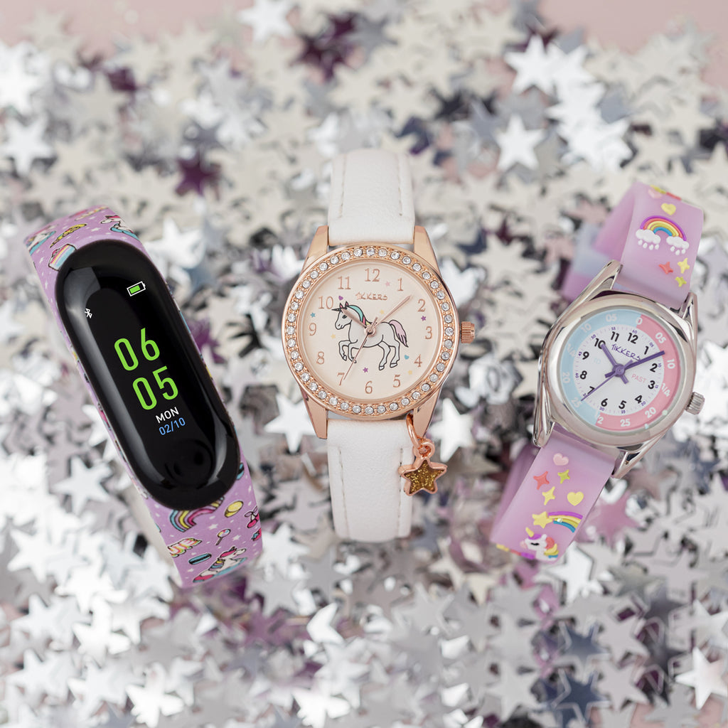 Three Tikkers unicorn watches displayed on a starry background