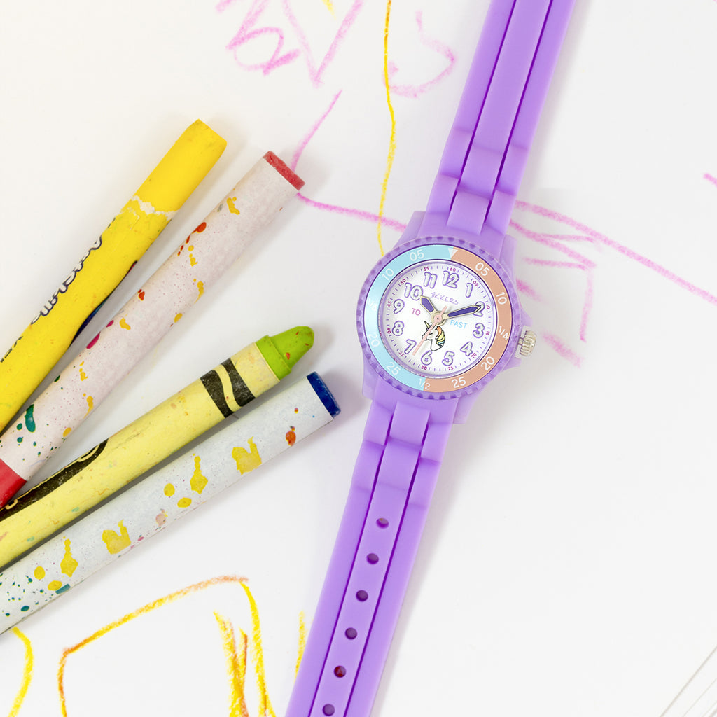Purple Time Teacher Tikkers watch creatively displayed on paper with colourful crayons